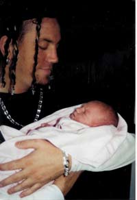 Brian Welch with a baby