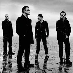 U2 posing on the beach