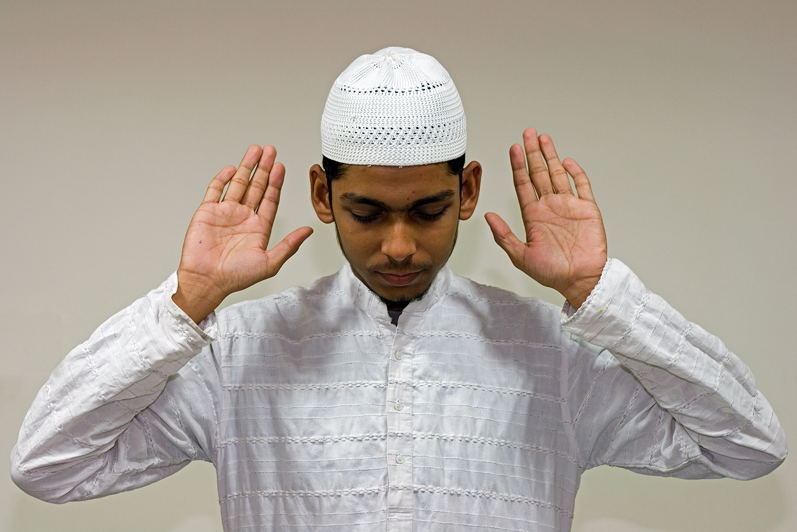 A Muslim man engaged in Muslim prayer