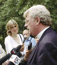 Bishop Michael Ingham speaking to reporters