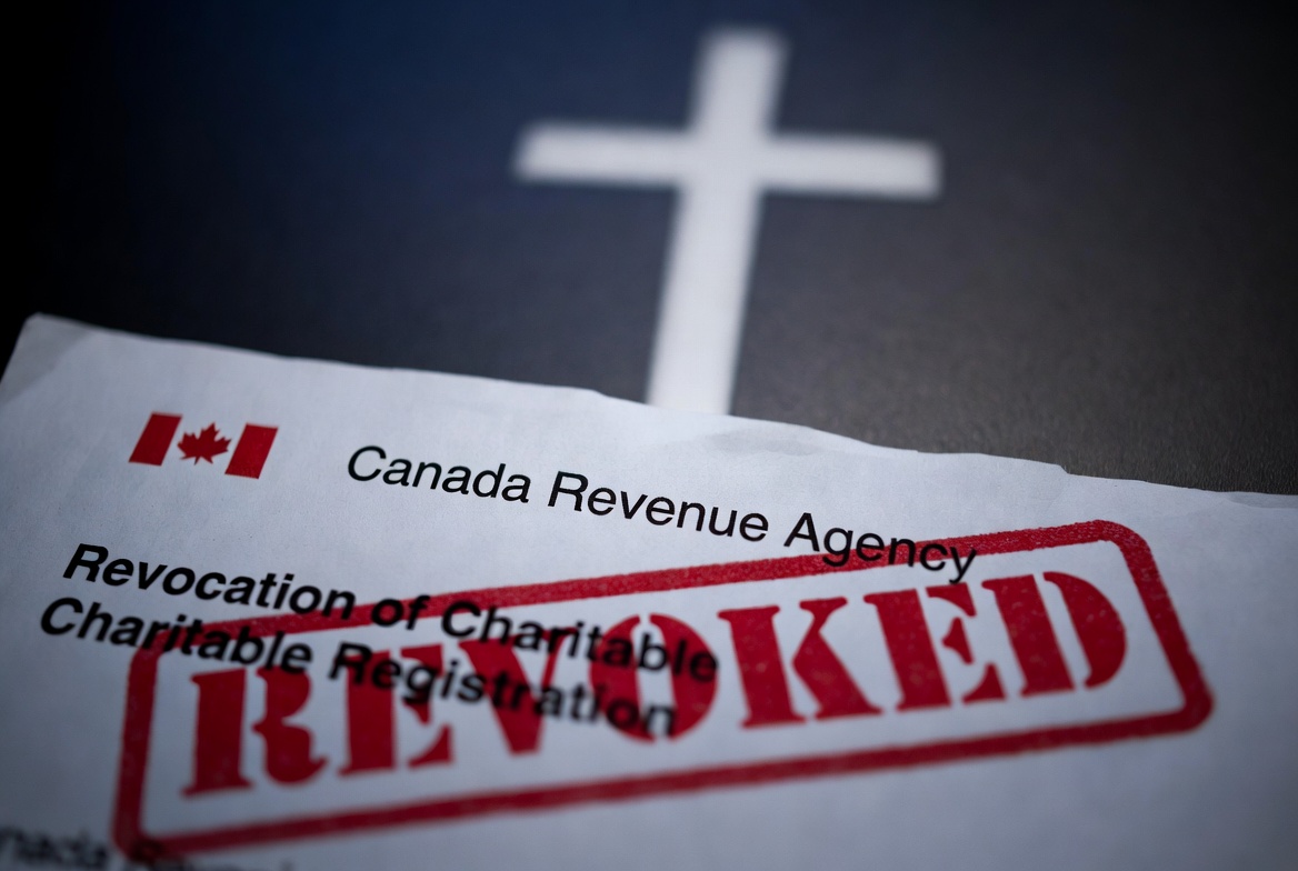 CRA Revoked Letter over a cross