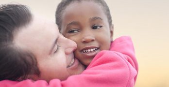 Man hugging a child