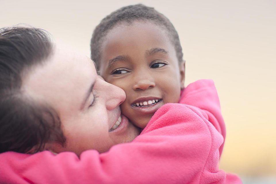 Man hugging a child